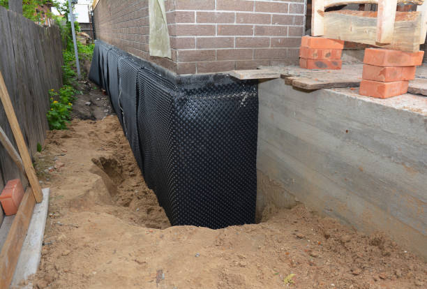 SJ Waterproofing Pros technician performing targeted Emergency Waterproofing assessment in Angola, IN